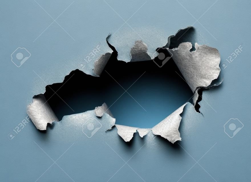 Ragged Hole torn in ripped paper on transparent background