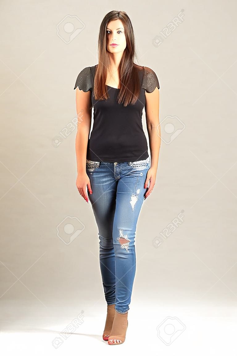 Walking long hair brunette woman front view. Full body length isolated over white.