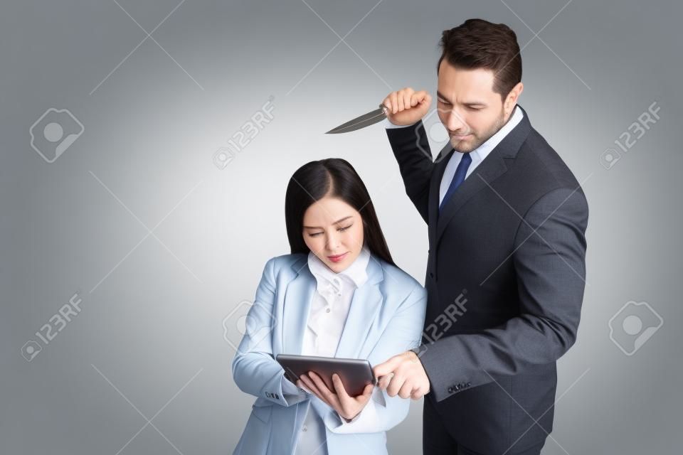 portrait businessman holding knife and businesswoman holding tablet isolated on white background (comparing betrayal concept)