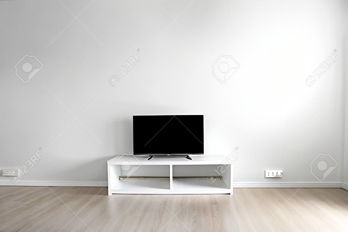 Lcd tv on white shef at modern room interior with nobody