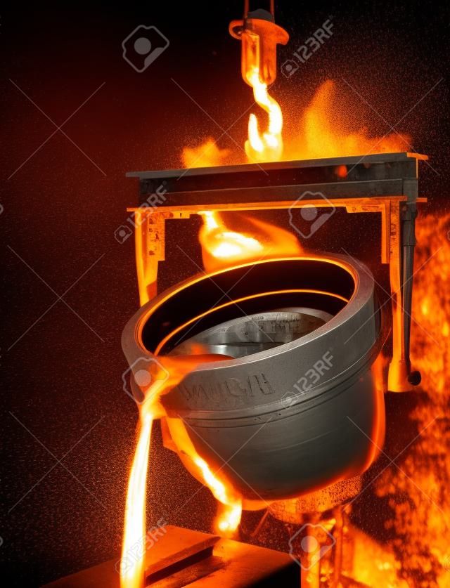 Illustration of molten metal being poured from a foundry crucible