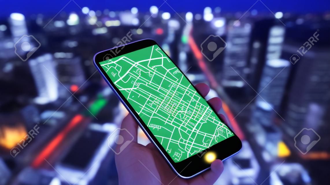 Mobile phone online map with big city lights on background. Gps map navigation with smartphone app. Location mark and automobile sign. emote data monitoring. Autonomous online car