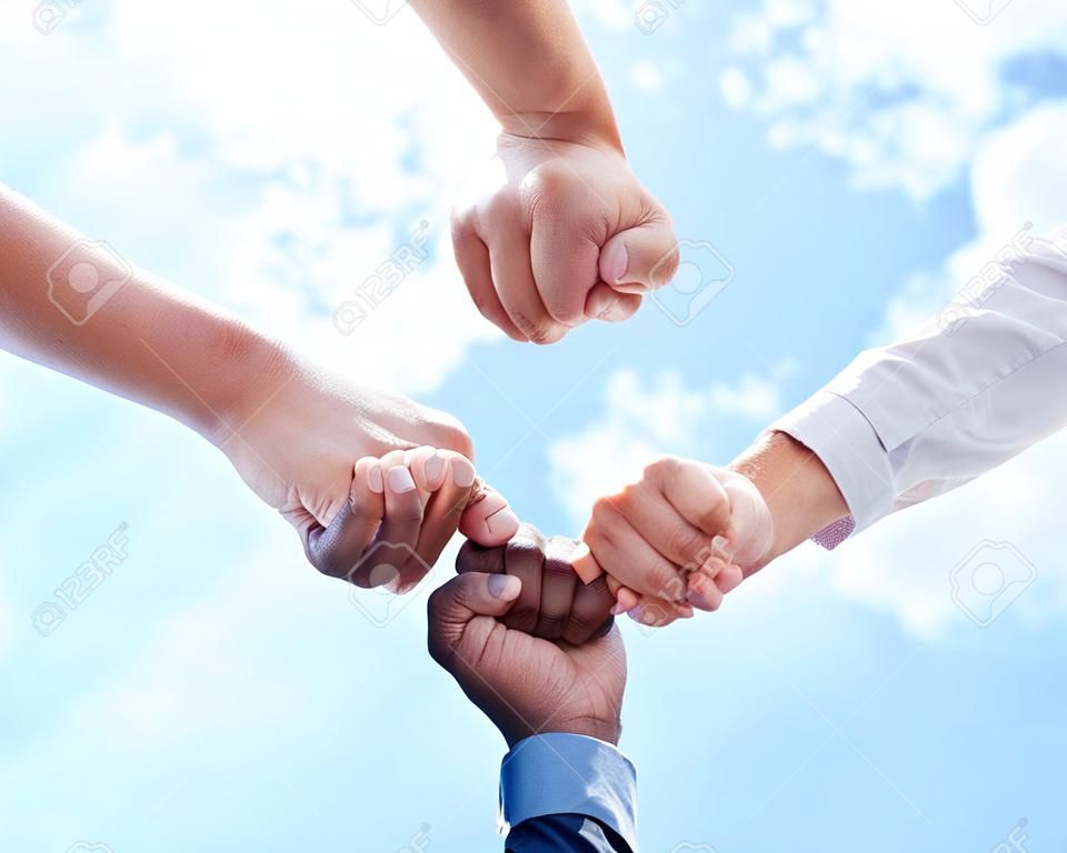 Teamwork collaboration, diversity fist bump and mission success of business. Partnership support, community team building goal and people group together. Contact us, we are hiring and staff hands