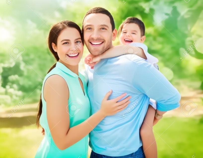 Happy, child and parents in a park to relax, adventure and care together during summer. Young, smile and girl with father and mother in nature for an outdoor holiday as a family in a garden in spring