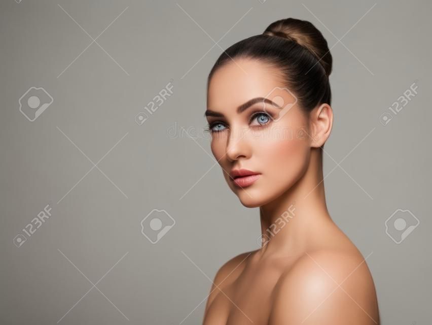She has a serious look about her. Studio portrait of an attractive young woman posing against a white background.