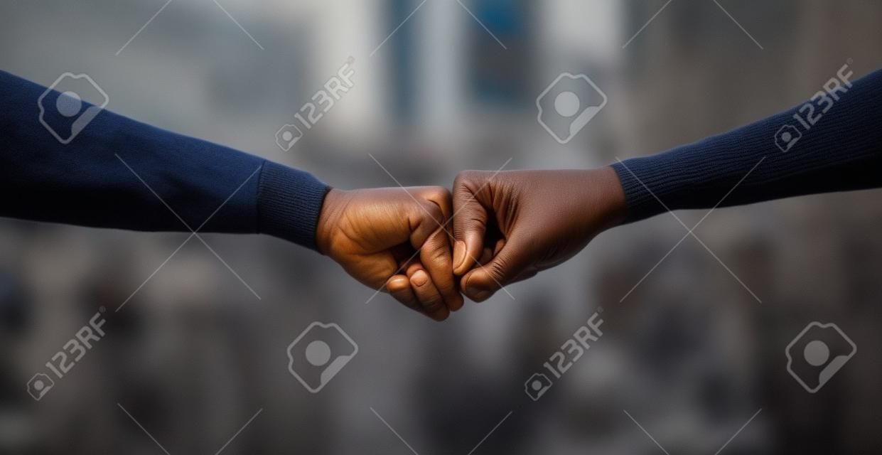 My kind, my force. Cape Town, South African - October 2, 2021 Unrecognisable demonstrators fist bumping during a protest.
