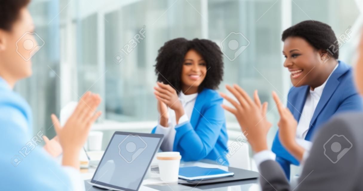 Promotion, meeting applause and happy black woman with business people clapping for kpi target announcement or career achievement. Congratulations, team support and employee excited job success news