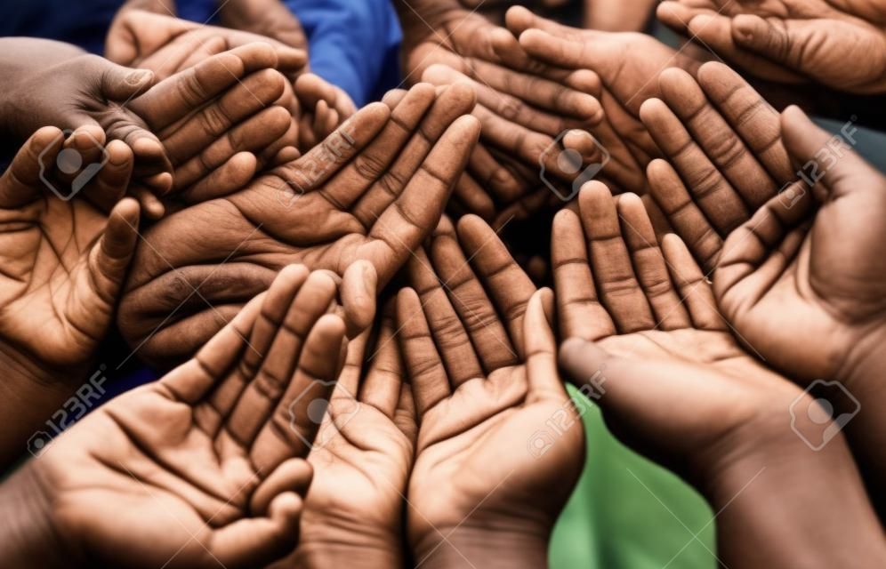 Open hands, diversity and help together with community, solidarity and support. Trust, faith and charity hands gesture with people and collaboration with crowd show palm and society and commitment