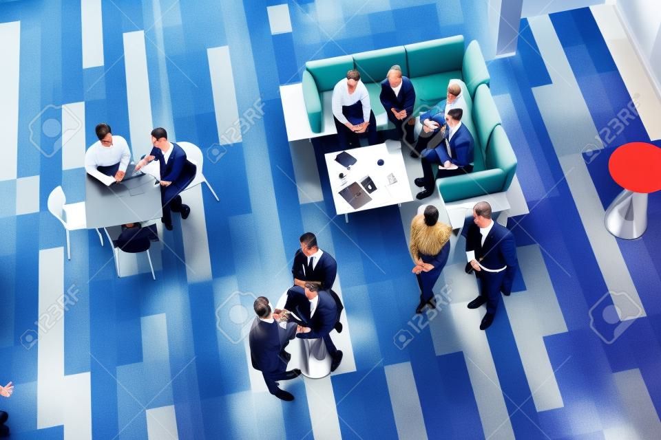 Where the movers and shakers meet up. High angle shot of a group of businesspeople having a meeting at a conference.