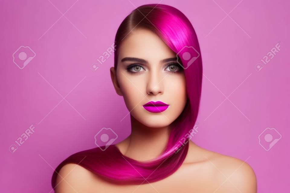 Portrait of young beautiful girl with long hair and fuchsia lipstick over white background, copy space