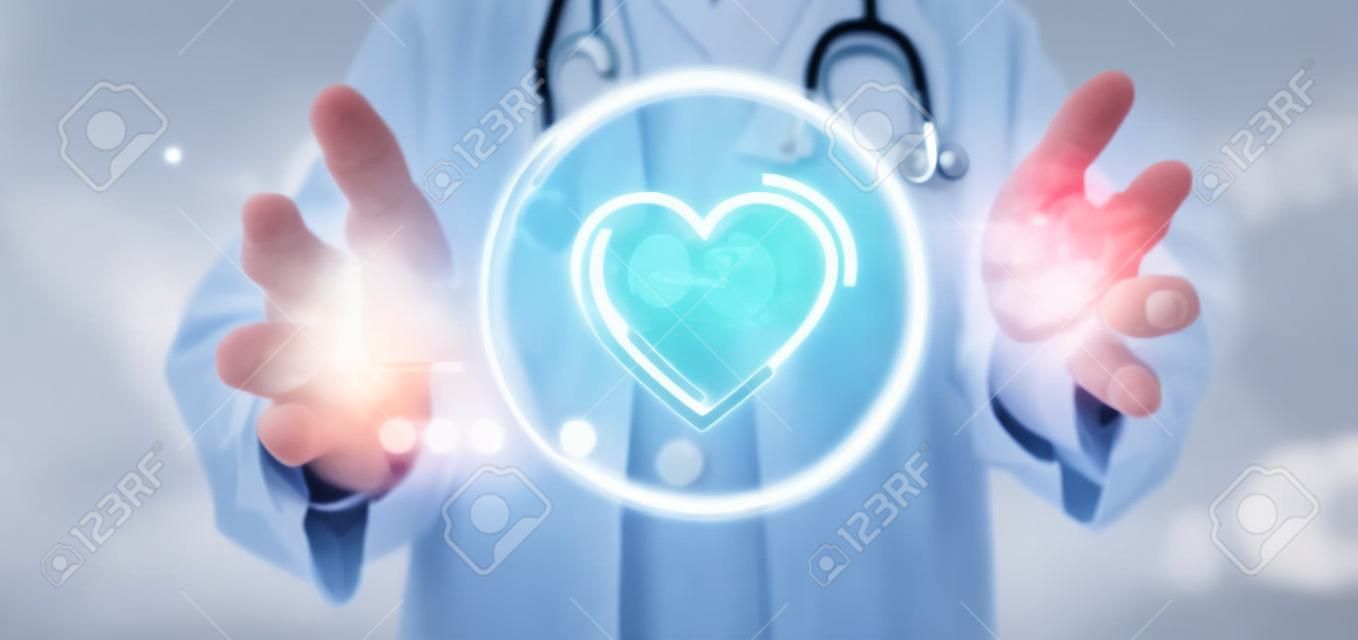 View of a Doctor holding a heart icon surrounded by data