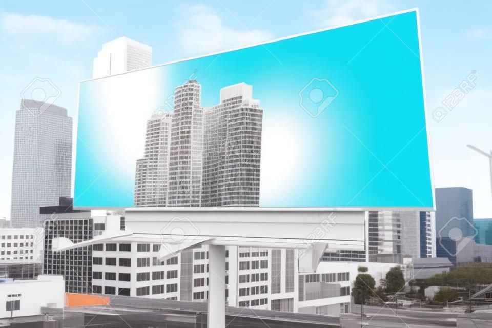 Blank white billboard on a background of buildings, mock up