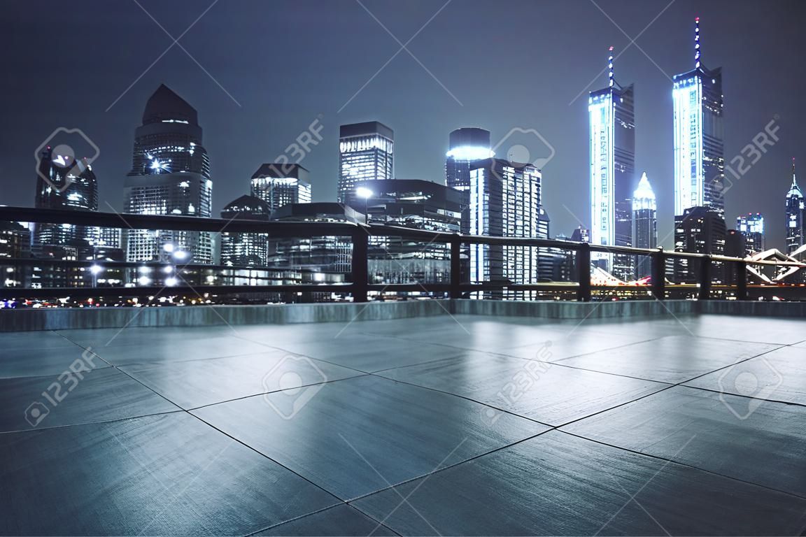 Concrete rooftop with beautiful night city view background