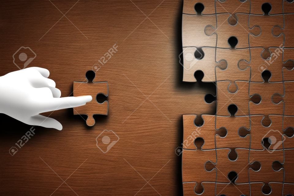 Creative background with hand fitting puzzle piece. Jigsaw and teamwork concept. 3D Rendering