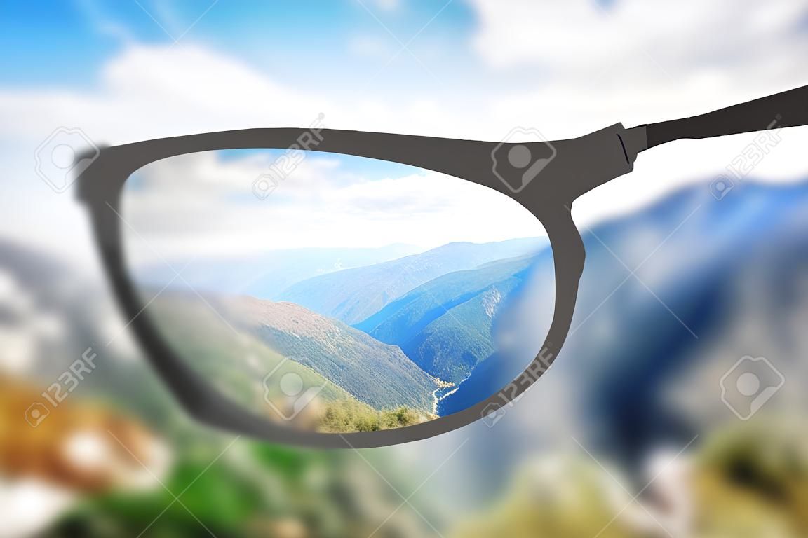 Creative nature view though eyeglasses. Blurry background. Vision concept