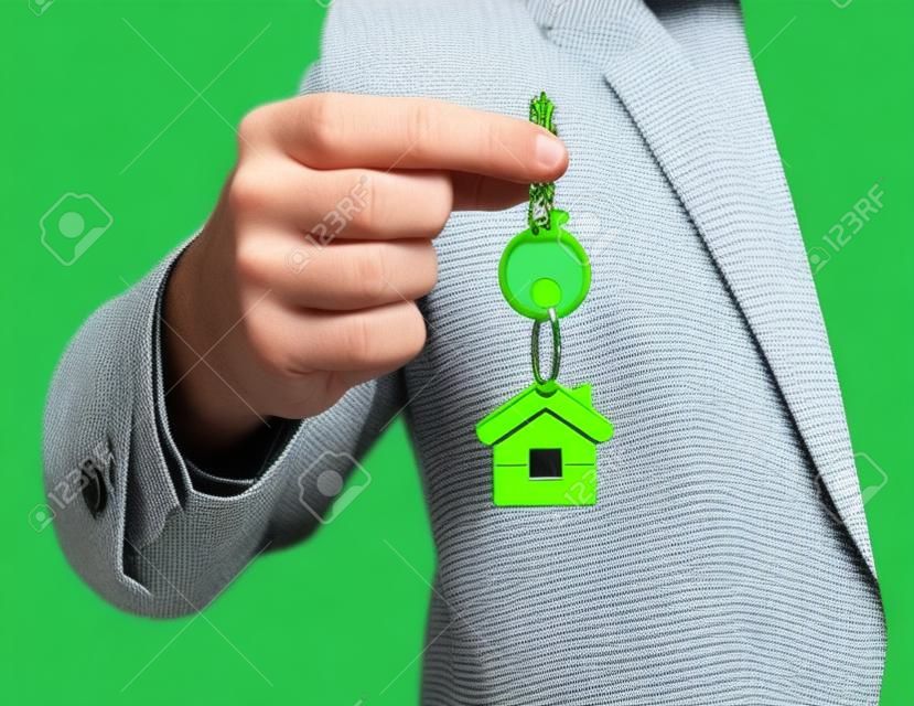 green key chain with key in hand  businessman