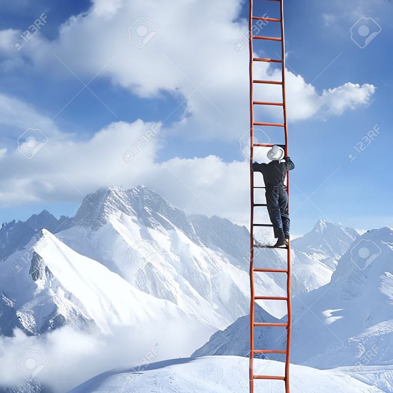 man climbing on ladder and mountains