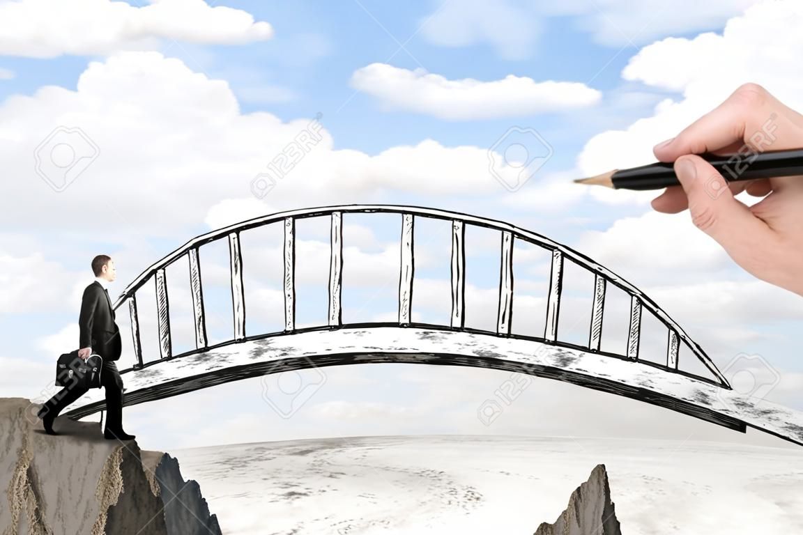 Succes concept met handtekening brug over kloof tussen twee kliffen en zakenman lopen over het op landschap achtergrond