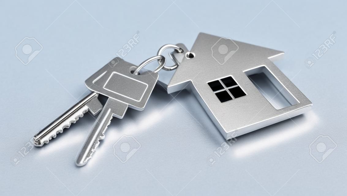 Silver keys with house trailer on white