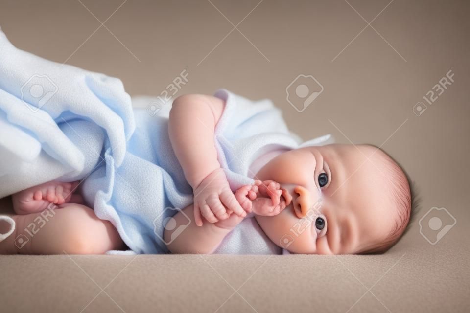 portrait of lying four months old baby girl