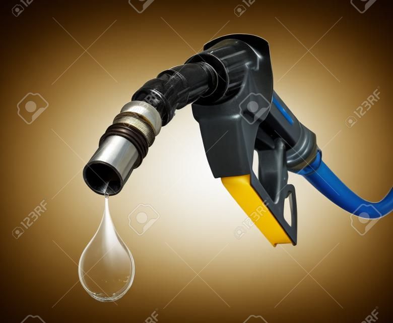 Oil dripping from a gasoline pump isolated on white background