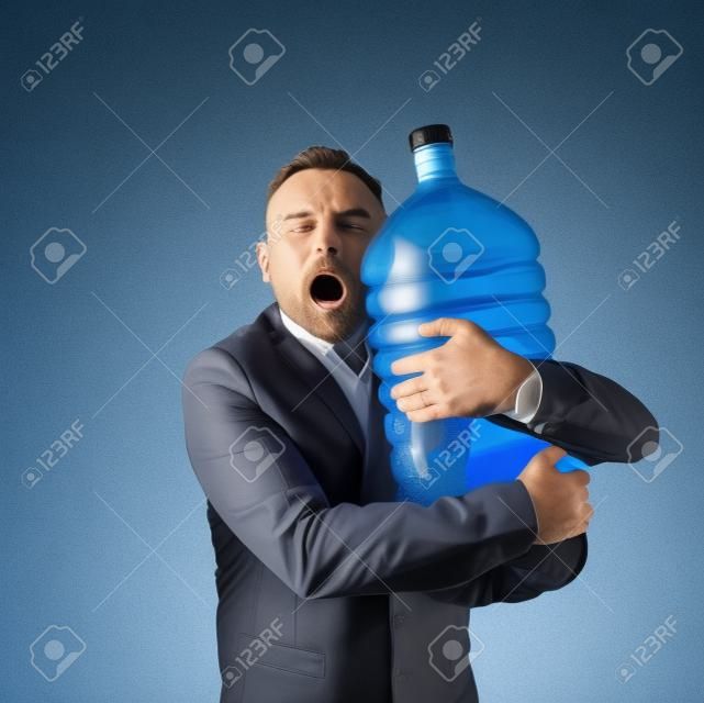 A Man With A Giant Water Bottle Stock Photo, Picture and Royalty Free  Image. Image 114132288.