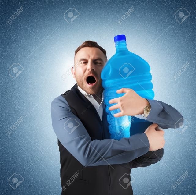 A Man With A Giant Water Bottle Stock Photo, Picture and Royalty Free  Image. Image 114132288.