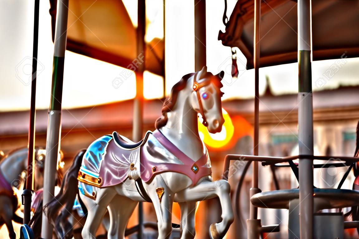 Multicolored horses on carousel at sunset in the city of Florence, the famous and amazing capital of the Italian Renaissance. Located in the Tuscany region