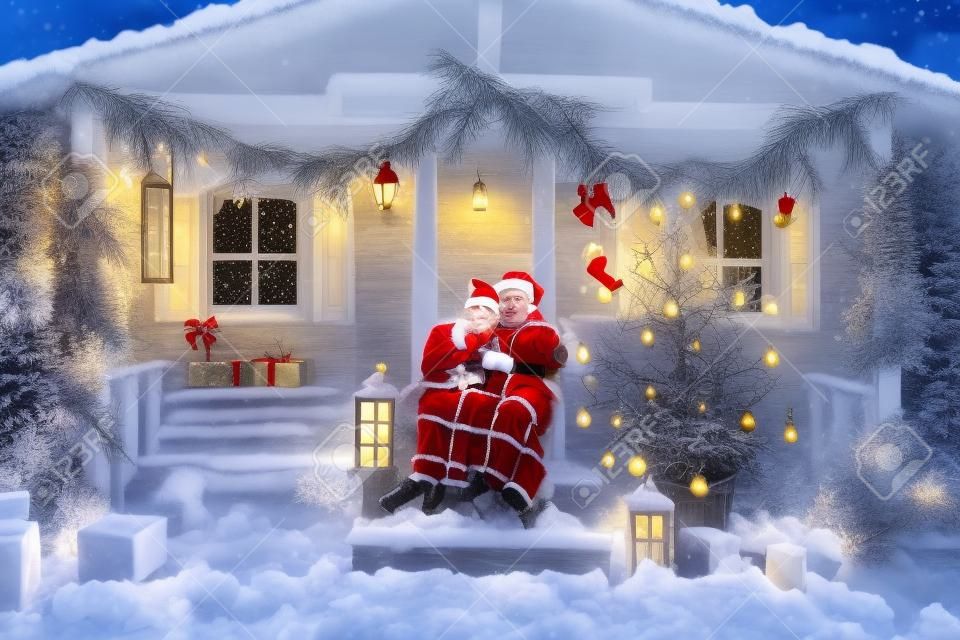 Christmas romance in Santa Claus hats beautiful house New Years atmosphere