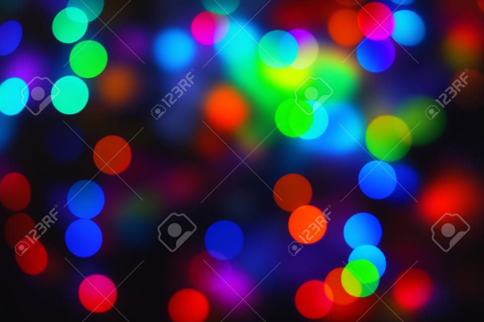 Color Bokeh against a dark background Abstract blurred circles