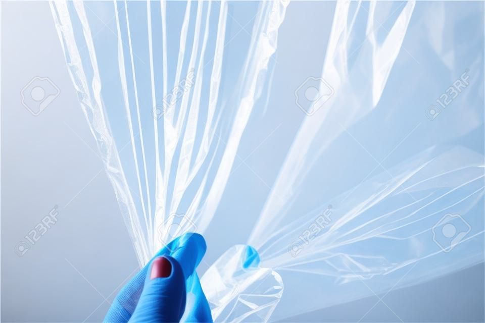 wrapping plastic transparent food film on white background. 