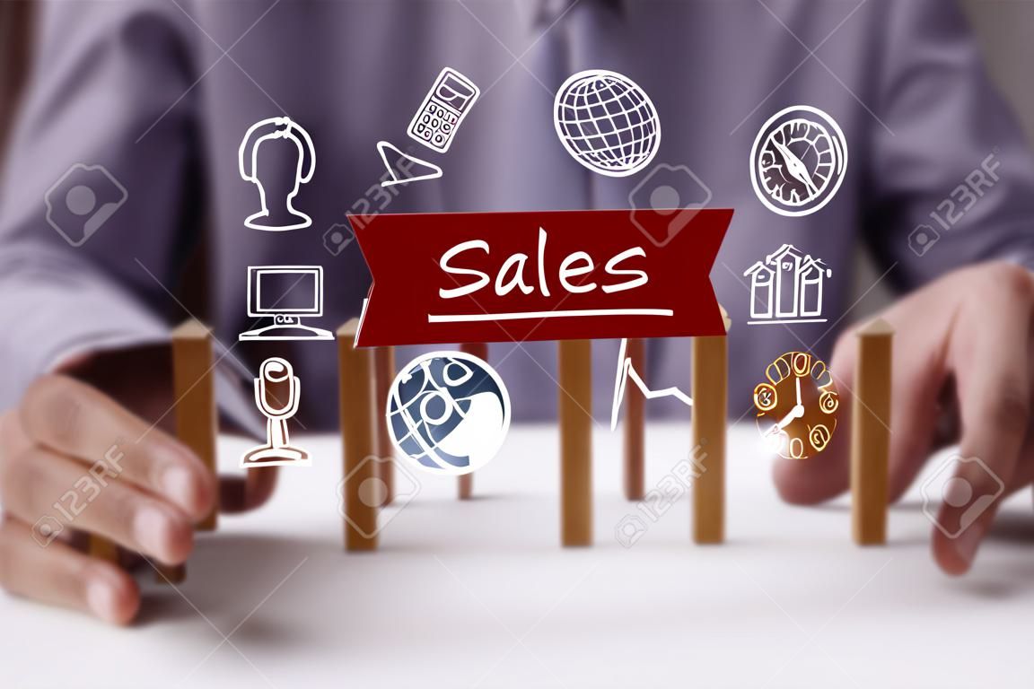 Business, Technology, Internet and network concept. Young businessman shows the word: Sales