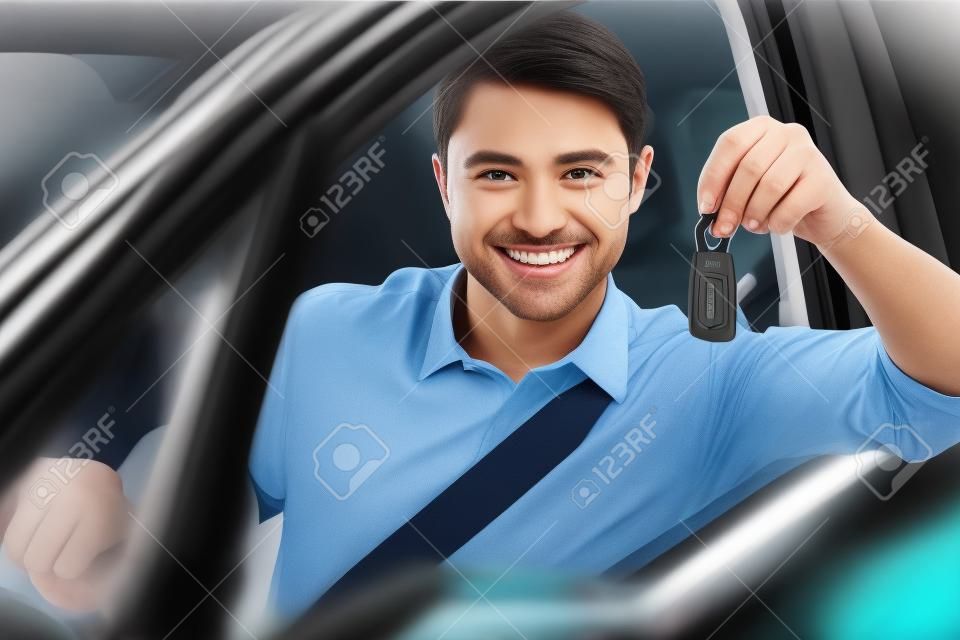 Man showing car key