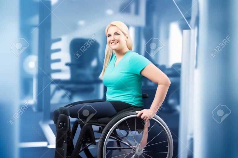 Woman with prosthetic legs in wheelchair