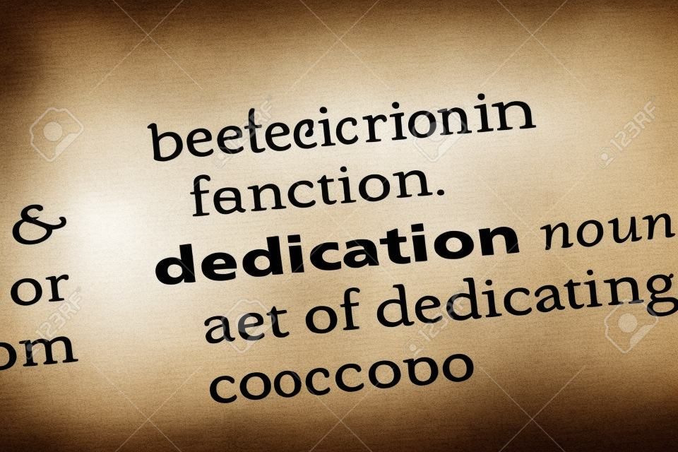dedication word in a dictionary. dedication concept