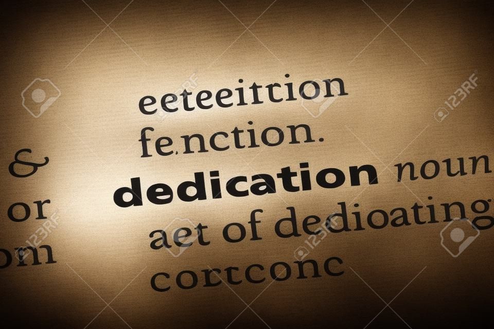 dedication word in a dictionary. dedication concept