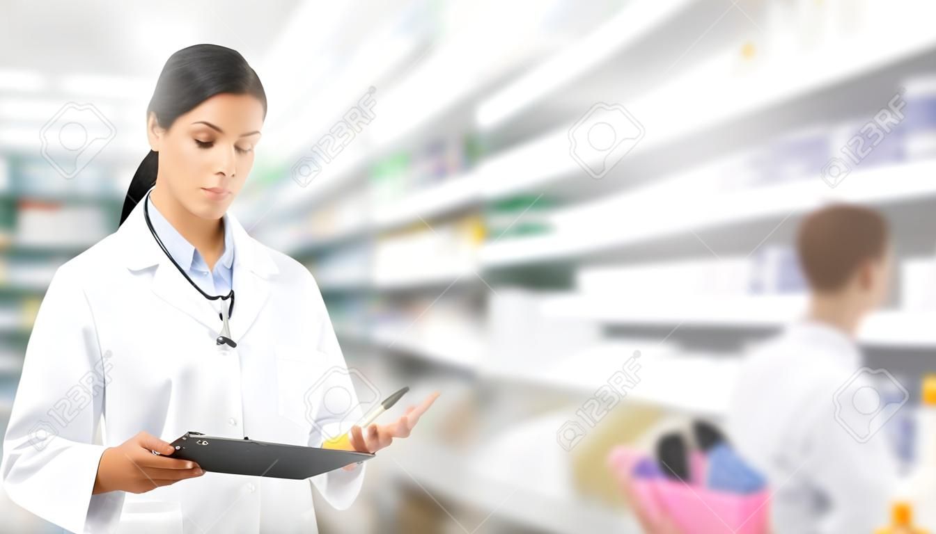 Woman pharmacist working at pharmacy. Medical healthcare and doctor staff service.