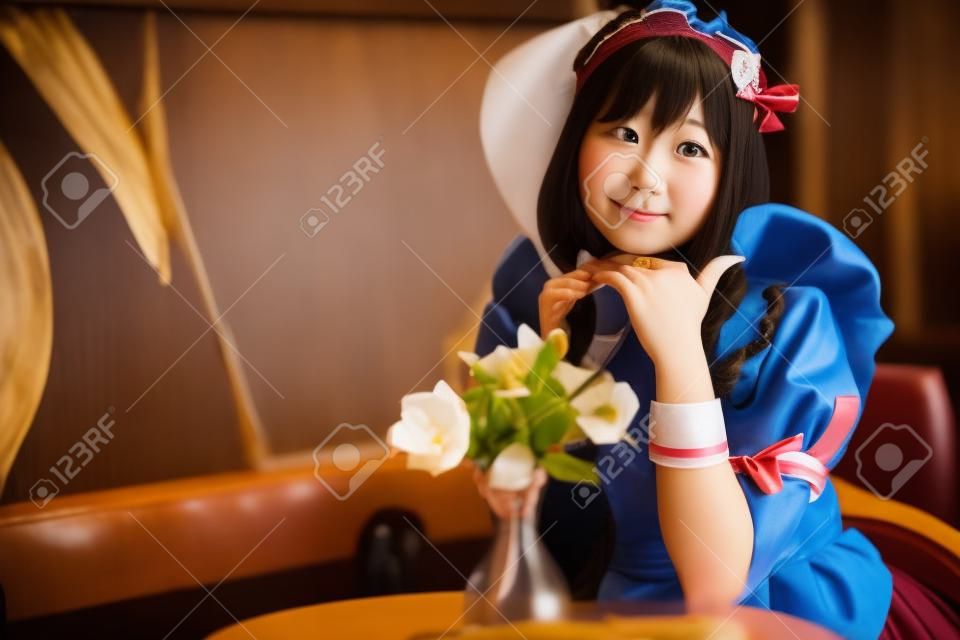 portrait of girl with japanese maid costume in vintage restaurant