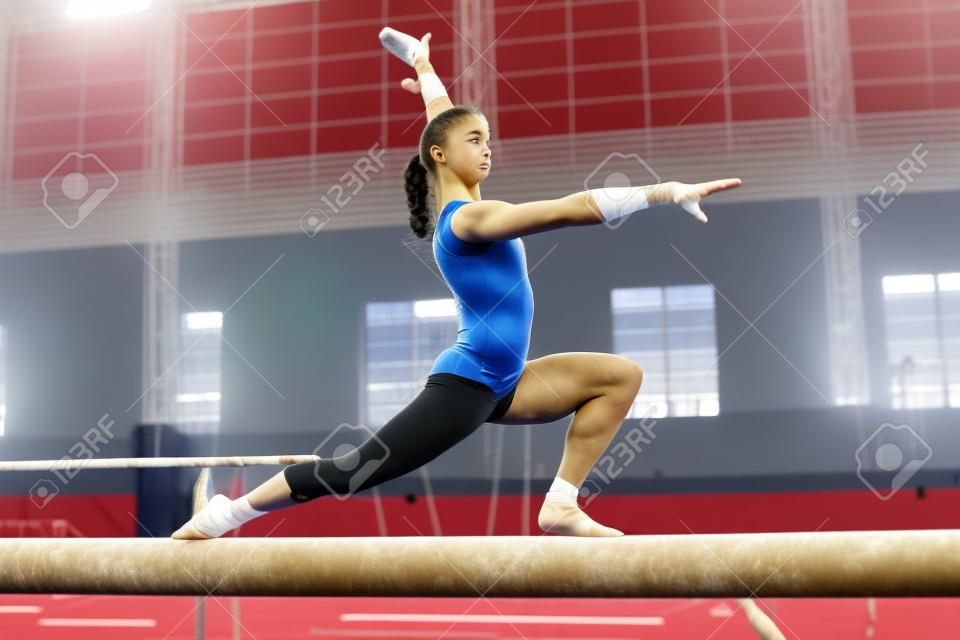 portrait of young gymnasts training in the stadium
