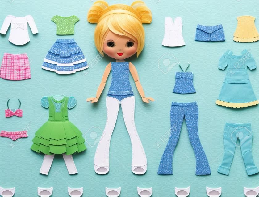Paper doll with set of clothes.