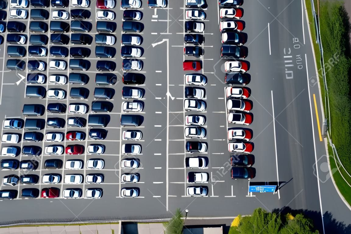 Aerial view of a parking lot with many cars