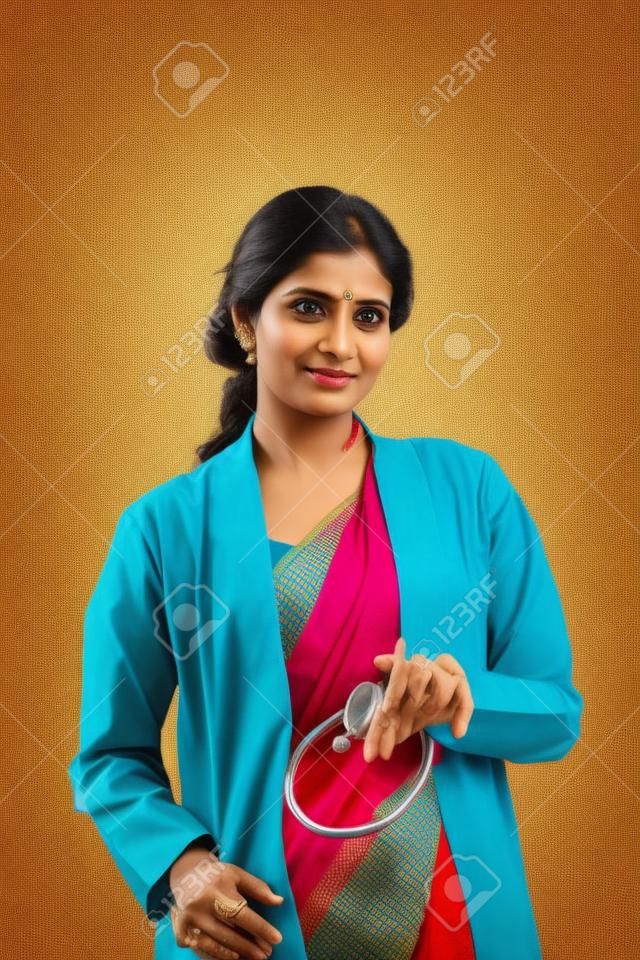 Indian beautiful Friendly lady doctor with stethoscope in sari