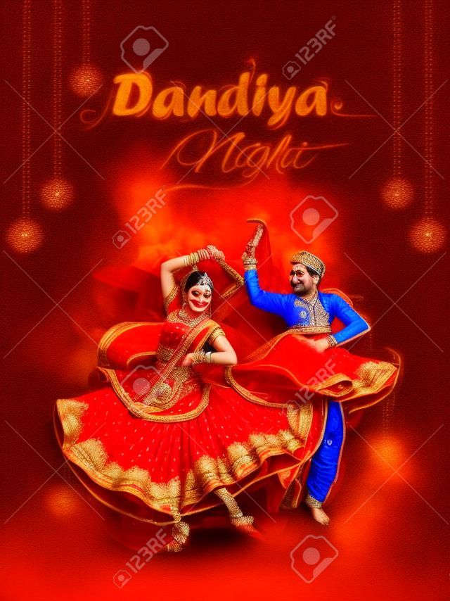 Indian couple playing Garba in Dandiya Night Navratri Dussehra festival of India