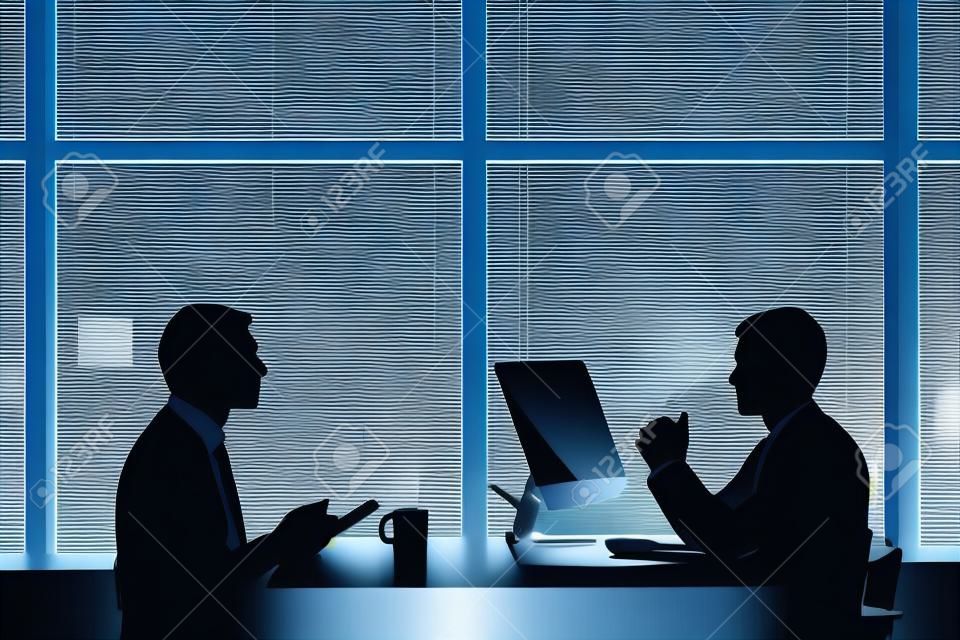 Lineamenti di due uomini d'affari che lavorano in ritardo in ufficio
