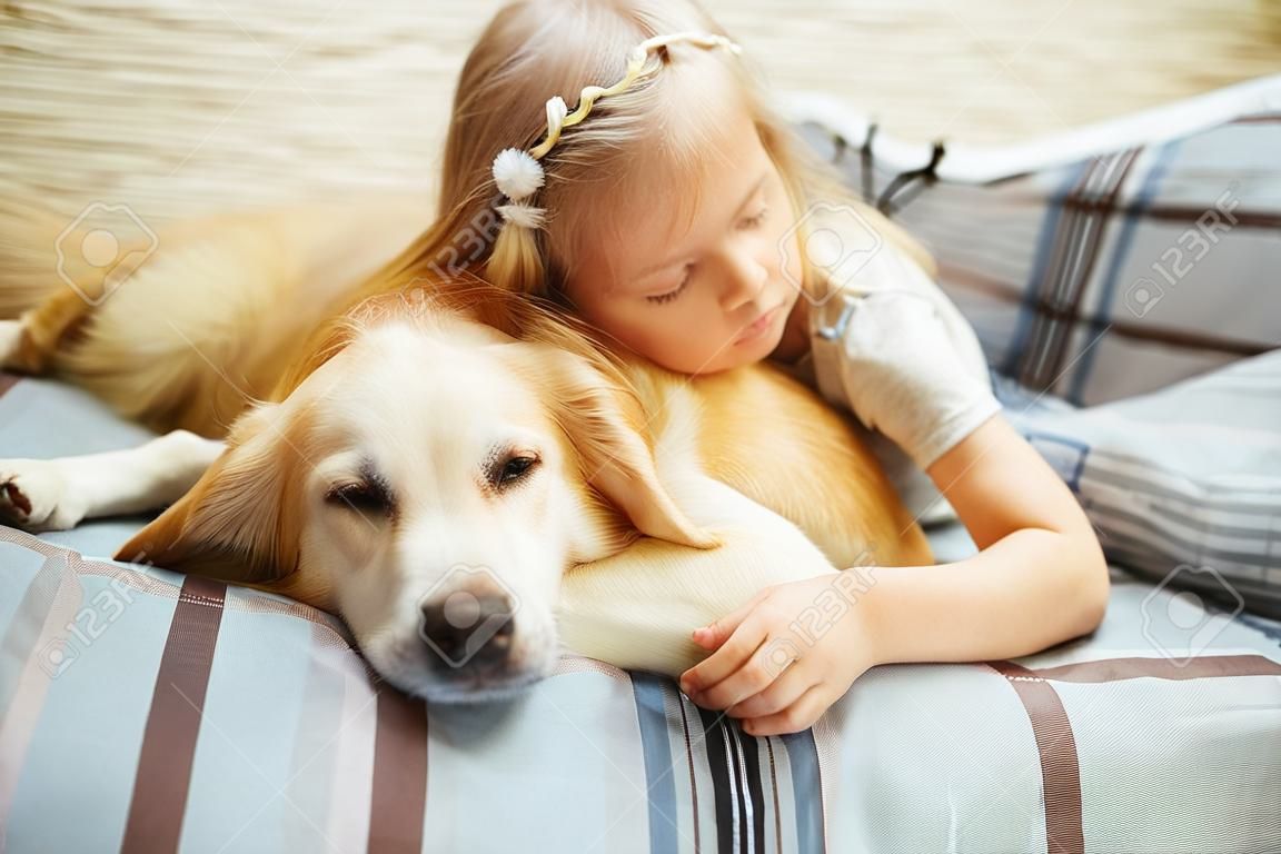 Cute child resting with dog