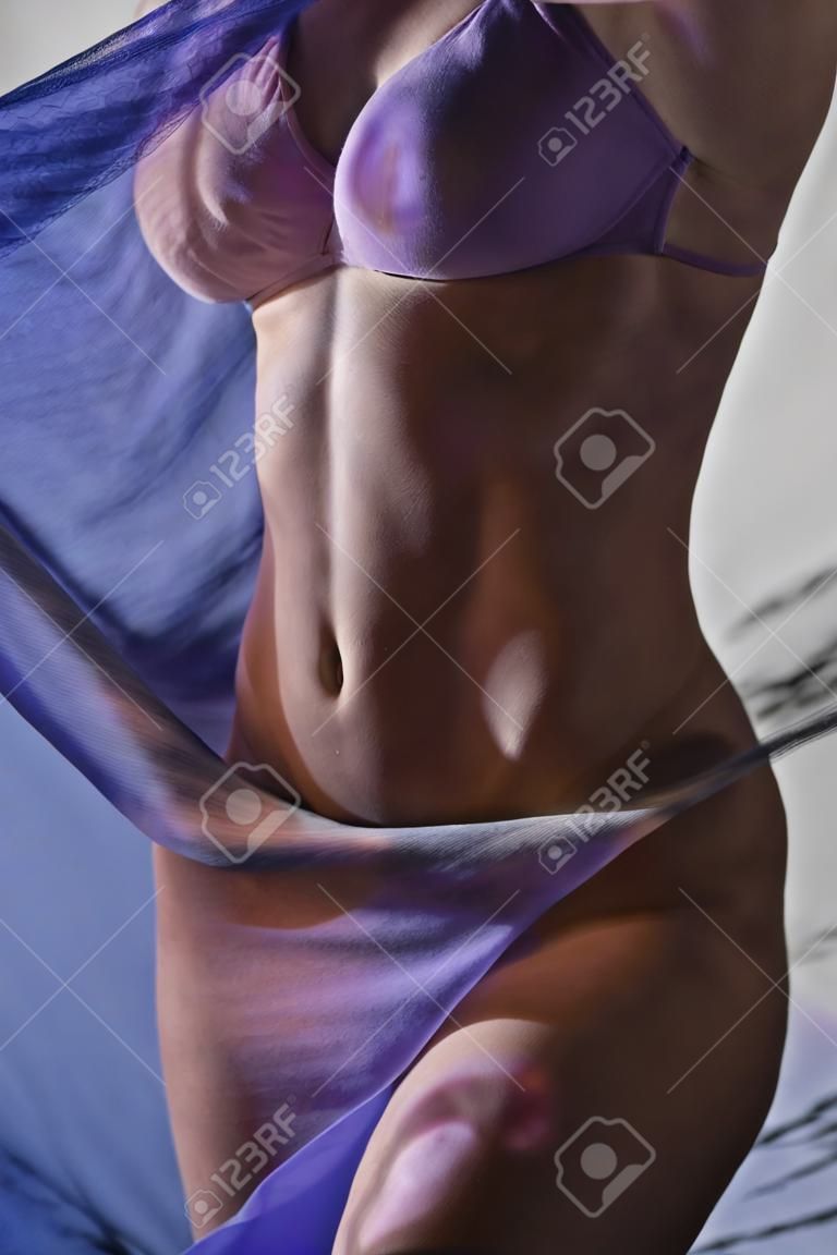 young woman with cloth closing bottom of body