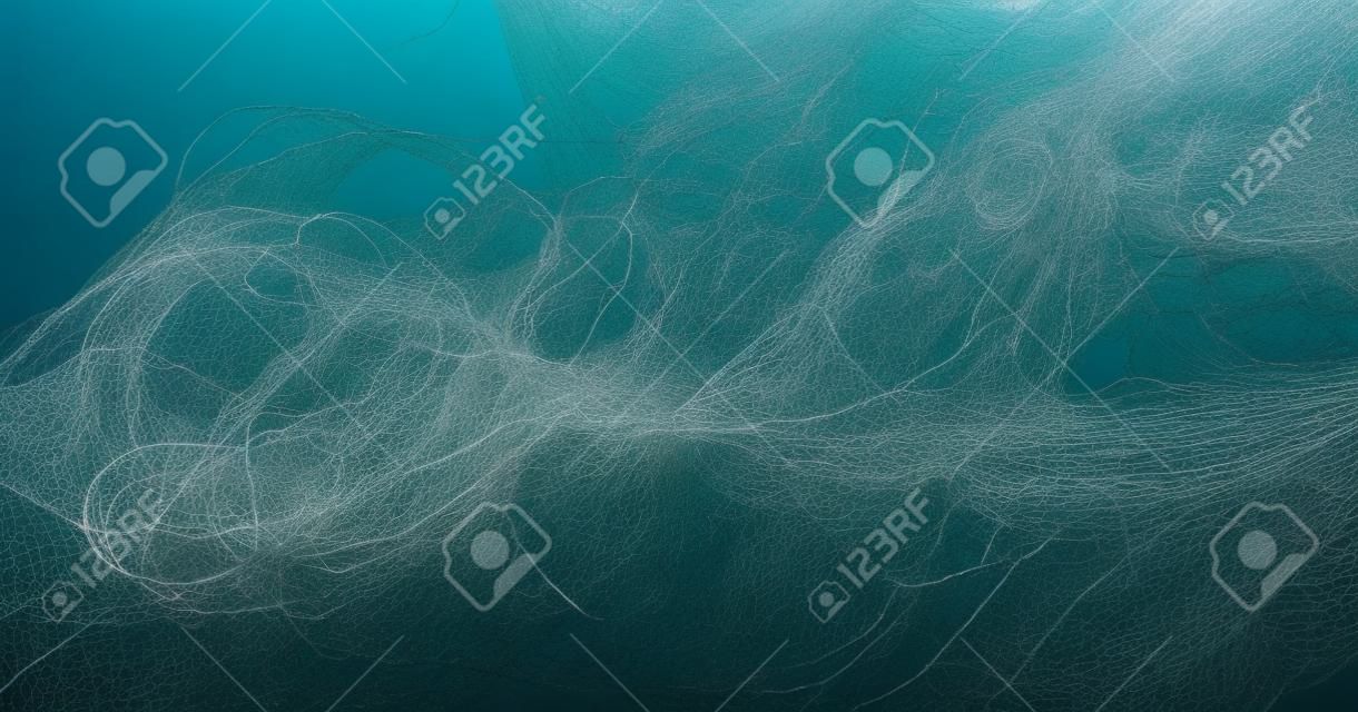 full frame picture showing a tangled fishing net