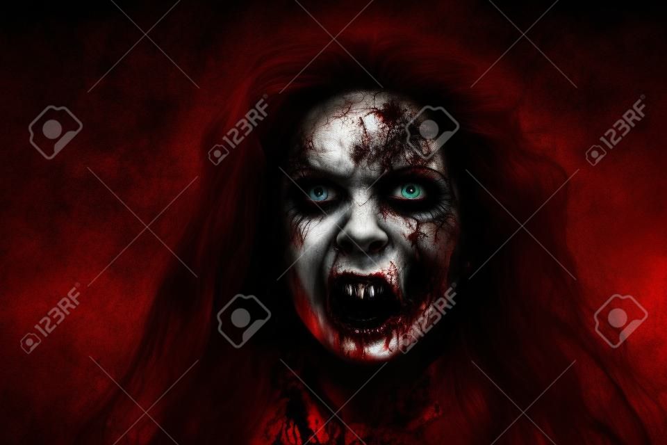 Portrait of a bloodthirsty zombie woman with faded eyes looking up and opening her bloody mouth. Devil possessed woman. Horror, thriller. Halloween.