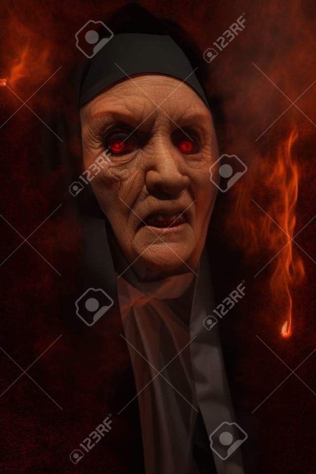 Halloween and Horrors. Portrait of a terrible cursed nun in the light of hellfire.