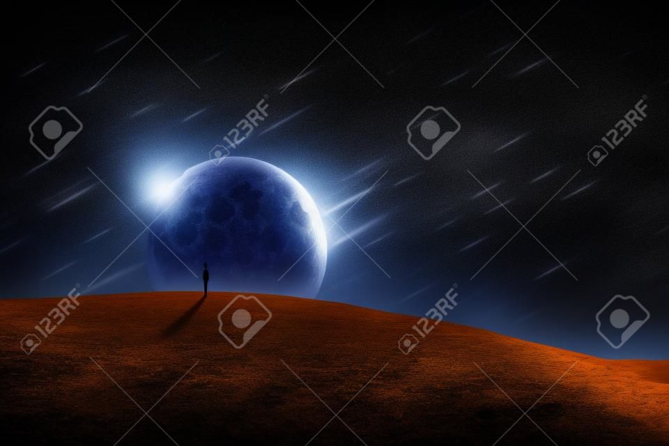 Surreal world scene with a person silhouette, alone on a dry empty land, looking at the starry night sky with comets falling, over a full moon background. Spatial phenomenon, conceptual landscape.